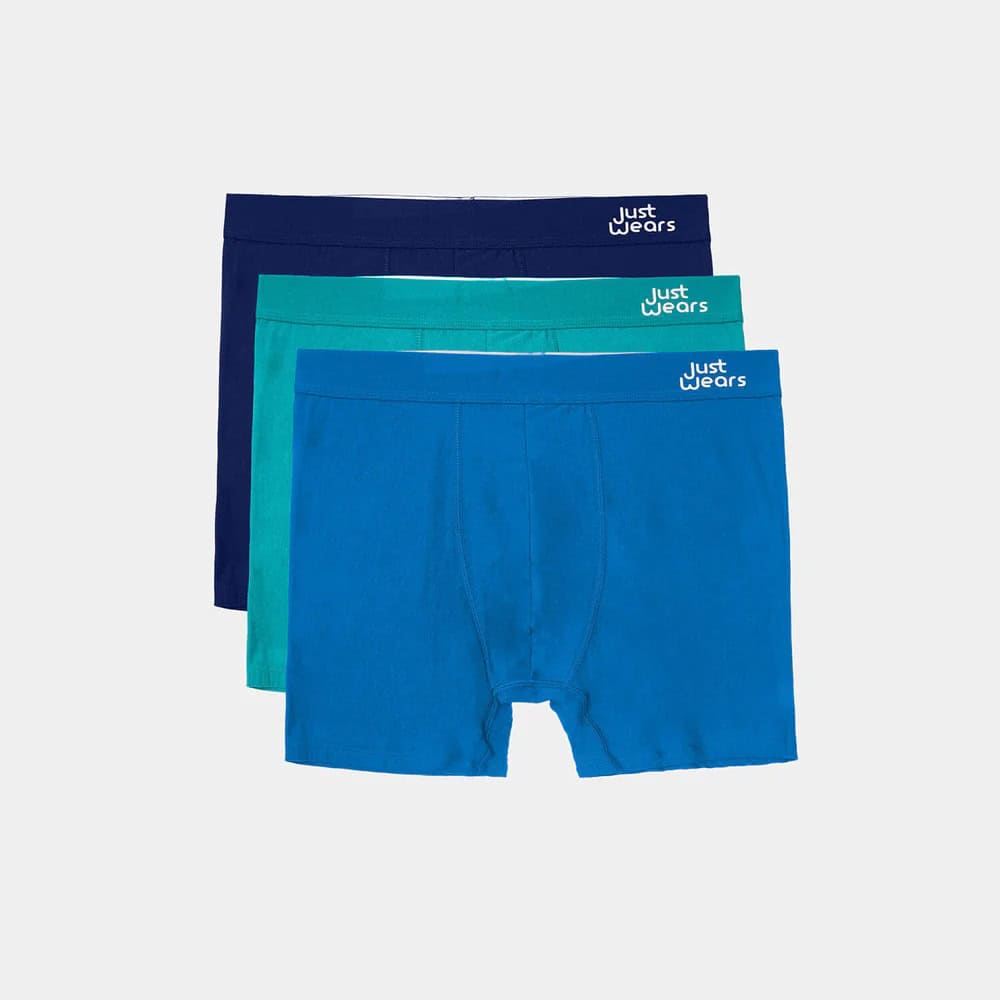 Three pairs of men's sustainable boxer shorts in blue and green colours from Just Wears