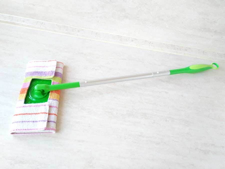 Mop with a reusable mop pad made from a towel.