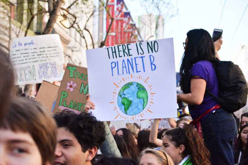 Environmental charity campaign group holding banners.