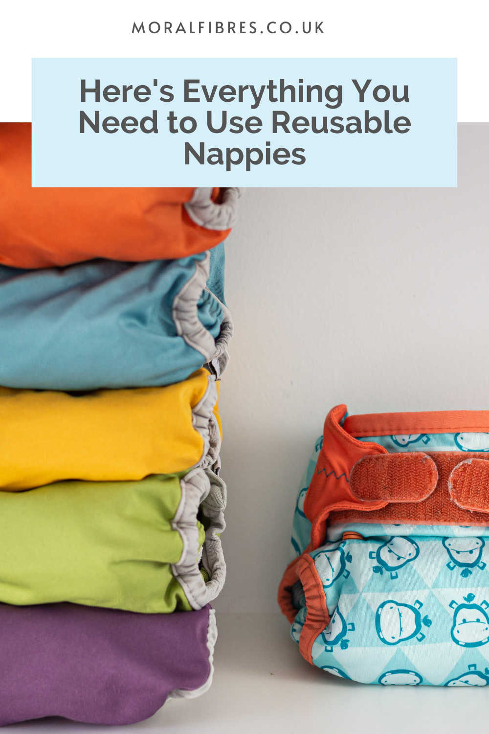 Pile of reusable nappies, with a blue text box that says here is everything you need to use reusable nappies