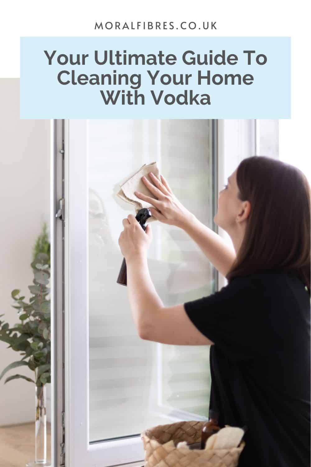 Person cleaning their window, with a blue text box that reads your ultimate guide to cleaning your home with vodka.