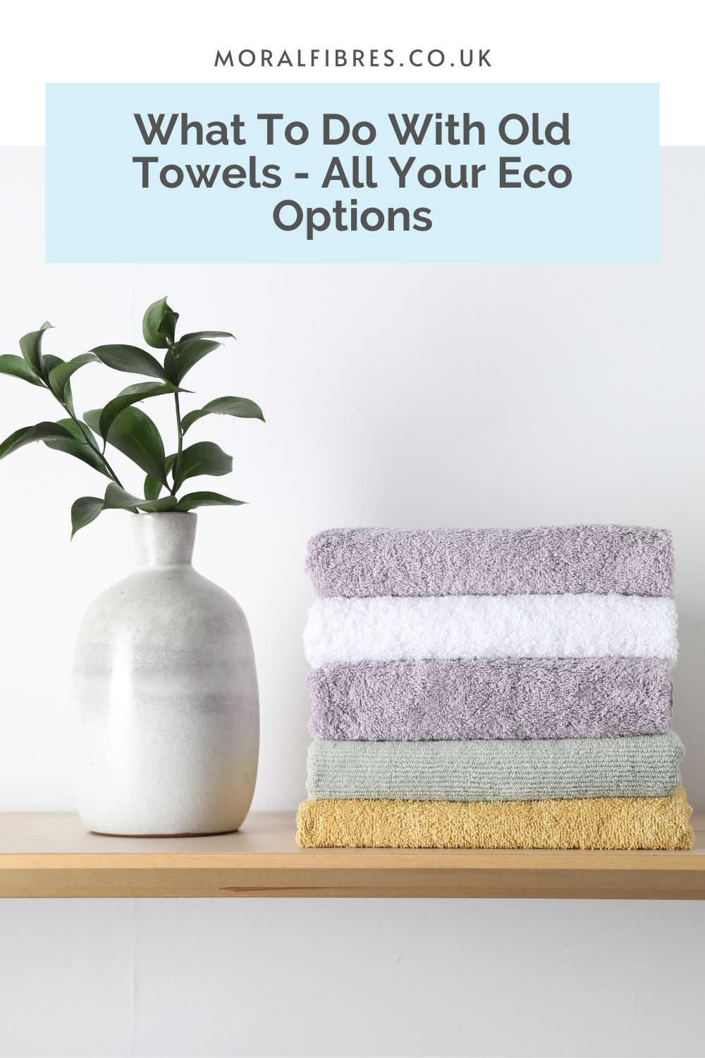 Stack of pastel coloured towels on a shelf, next to a plant, with a blue text box that reads what to do with old towels - all your eco options.