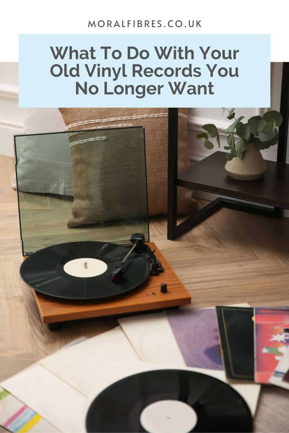 Record player on a wooden floor surrounded by records, and a blue text box that reads what to do with your old vinyl records you no longer want.